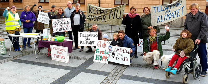 Människor med plakat, manifestation för klimatet